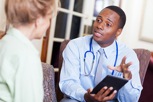 A doctor speaking to a patient